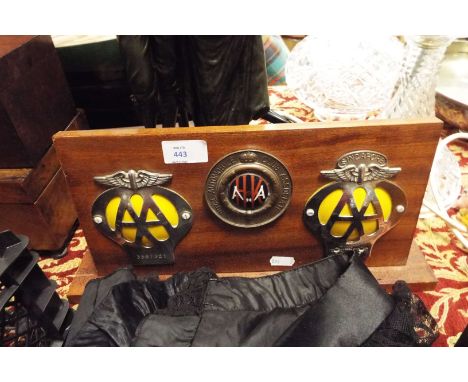A Royal Automobile Club Associate enamel and brass car badge, a chrome and yellow enamel Singapore AA badge plus one other mo