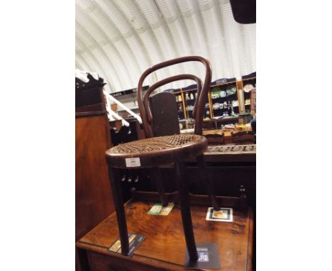 An early 20thC child's Bentwood side chair with cane upholstered seat 