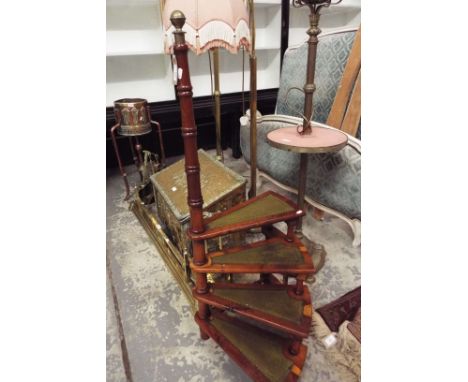 A set of late 19thC early 20thC yew wood four tread library steps with tooled leather inserts and ring turned hand rail with 