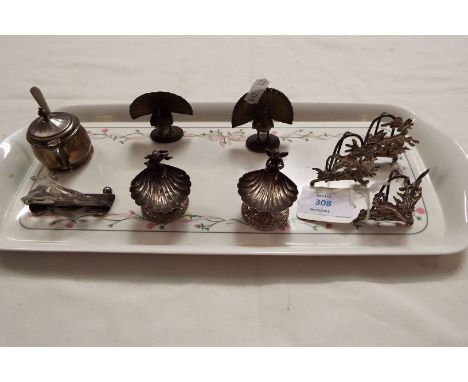 A pair of 800 silver shell-shaped salts, three hunting-themed menu holders and another silver one, a silver mustard pot, two 