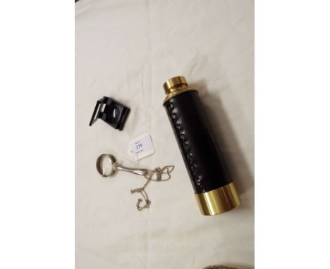 A small silver-plated magnifying glass on a chain together with a Wilkinson magnifier, plus a three drawer leather bound tele