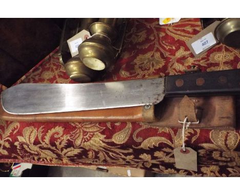 A mid-20thC 'Martin Dall' machete with leather scabbard