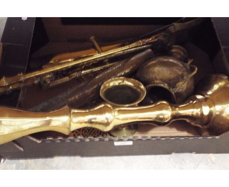 A box of assorted brass-ware to include large candle-stick, horse brasses, shell cases, pestle & mortar and brass fire irons