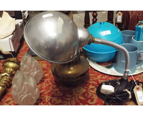 A 1920s/30s adjustable desk lamp with aluminium shade and cast iron scallop shaped base