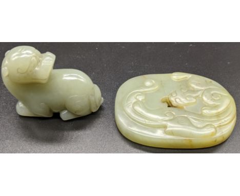 A Chinese jade carved paperweight, L.6.5cm  together with a jade carved dragon, L.5cm (2)