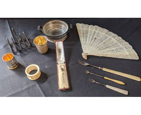 A collection of assorted bone and silverware to include a silver toast rack, hallmarked Birmingham, 1914, maker Henry William