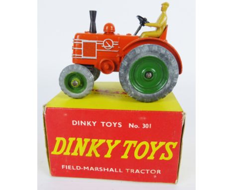 Dinky Toys die-cast model 310 Field-Marshall Tractor, orange body with green hubs, with original card inset, in red & yellow 