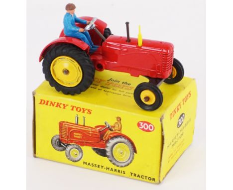 Dinky Toys die-cast model 300 Massey-Harris Tractor, red body with yellow hubs & exhaust, blue driver, boxed   Condition Repo