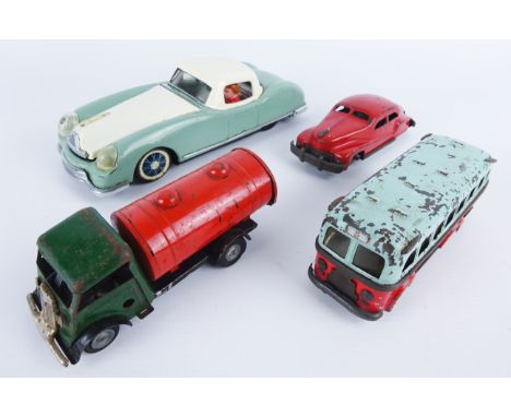 Tri-ang Minic tinplate clockwork BP tanker, a friction tinplate car, a clockwork tinplate bus and another friction car with m