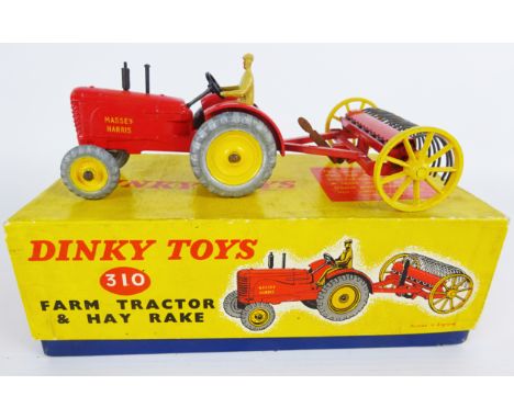 Dinky Toys die-cast model 310 Farm Tractor & Hay Rake red body with yellow hubs, brown driver, in lift off box with card inne