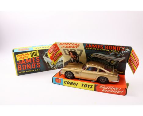 Corgi die cast James Bond's Aston Martin DB5, 261, gold with wire wheels and bandit figure, boxed with inner pictorial tray c