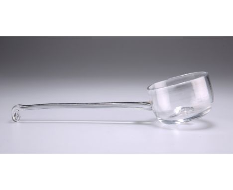 A GLASS LADLE, CIRCA 1770, the bowl cup shaped with a pronounced pontil mark, the handle attached to the bowl at an angle wit