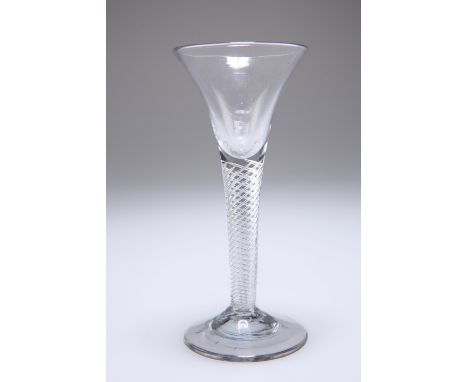 A GEORGIAN WINE GLASS, the drawn trumpet bowl on a multi-spiral stem, raised on a slightly domed conical foot. 16.5cm highThe