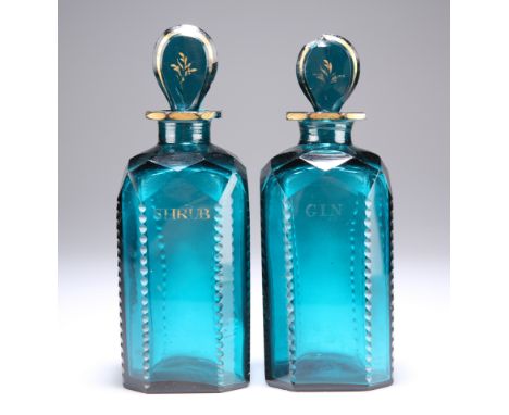 A PAIR OF GEORGIAN TURQUOISE DECANTERS,&nbsp;one 'gin' the other 'shrub' with gilt lettering and a gilt 'G' on the gin stoppe