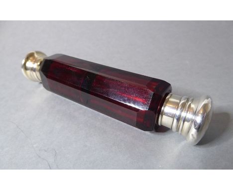 A late 19th century ruby cut-glass double-ended perfume bottle(The cost of UK postage via Royal Mail Special Delivery for thi