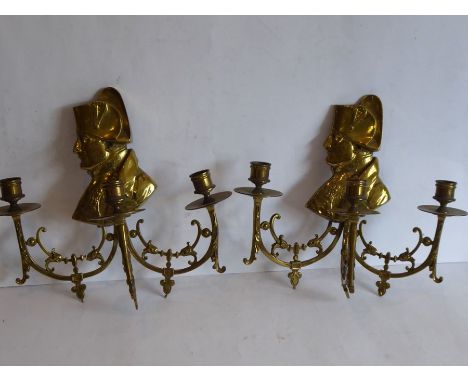 Two late 19th/early 20th century three-light brass wall appliques; each headed with shoulder length profile of Napoleon (32cm