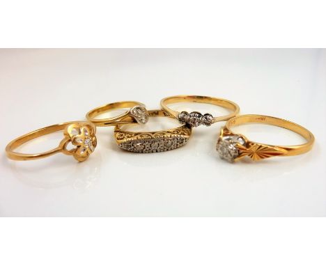 Five diamond-set rings: the first of navette design and set with 5 diamonds, stamped '18ct PLAT', size J; the second coronet-