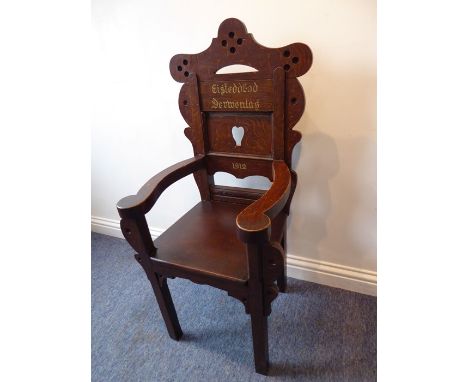 A Welsh oak (subsequently found to be 'grained' and NOT ACTUALLY OAK)  Bardic Eisteddfod throne inscribed Derwenlas (near Mac