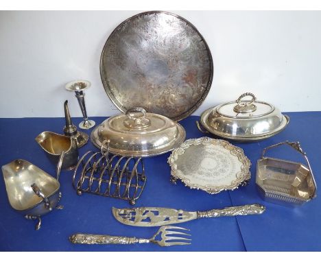 A variety of mostly 19th and early 20th century silver plate; to include a circular embossed serving tray in 18th century-sty