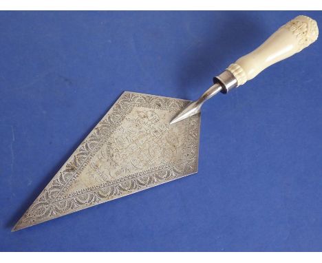 A late 19th century lozenge-shaped presentation hallmarked silver trowel having beautifully carved ivory handle, inscription 