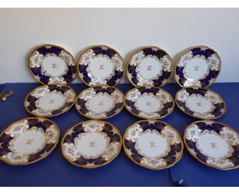 A set of 12 early 20th century fine Coalport porcelain dessert plates; each with raised beaded gilded border and hand-decorat