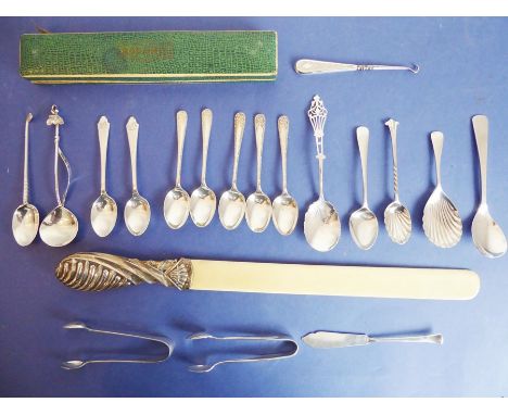 A selection of silverware; to include 14 spoons (mostly teaspoons and to include a shell-shaped caddy spoon), two sugar tongs