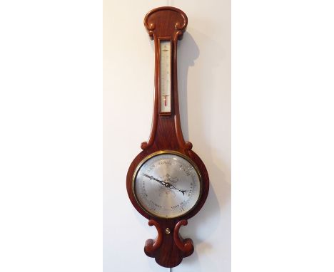 A good and large mid-19th century rosewood-cased wheel barometer; the silvered thermometer dial above a silvered circular reg