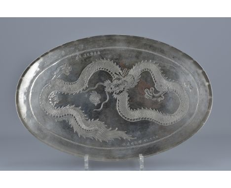 A Silver tray dated 1947 with Hong Kong style dragon decoration. 36cm x 23cm