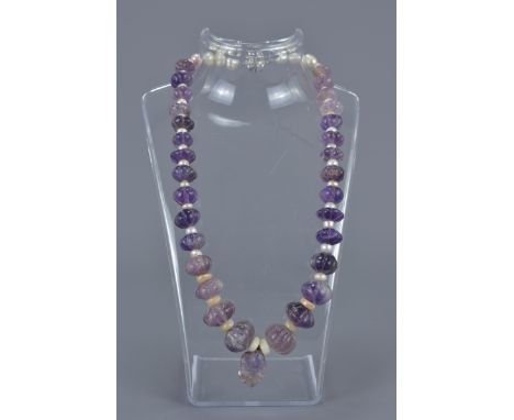 An amethyst stone and cultural pearl beaded necklace with magnetic clasp.