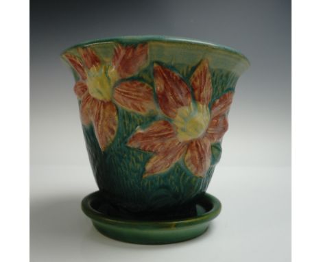 Roseville Pottery planter with matching saucer in the Clematis pattern, featuring large relief-molded clematis blossoms in sh