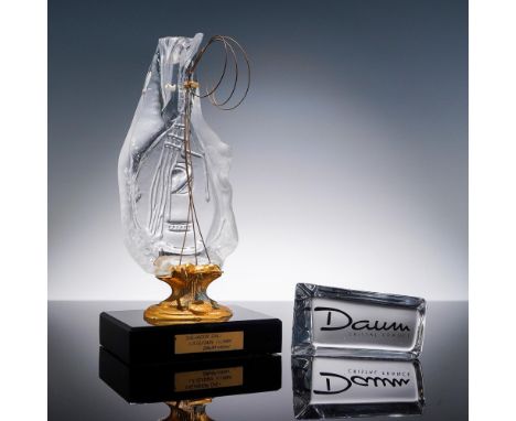 A striking two-piece lot featuring Daum's 1984 Salvador Dali La Guitare crystal figurine-an abstract, guitar-shaped clear cry