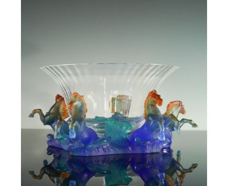 This elegant Daum France crystal bowl showcases a finely fluted clear crystal form artfully perched on a vibrant pate de verr