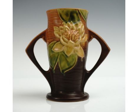 Striking Art Deco-style vase by Roseville Pottery in the Water Lily pattern, finished in a rich brown glaze with vibrant gree