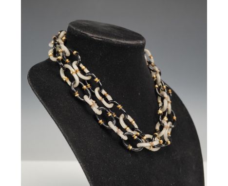 Striking mid-century necklace designed by Archimede Seguso for Chanel, featuring interlocking links of clear and black Murano