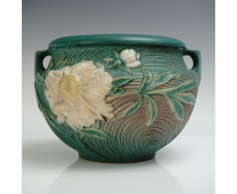 Roseville Pottery jardiniere in the Peony pattern, showcasing creamy white peony blossoms and green leaves in high relief aga