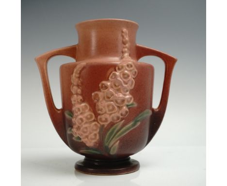 Pottery vessel in the Foxglove pattern featuring tall, tapering blossom clusters of dusty pink and green leaves on a pink to 