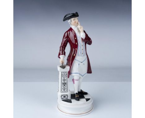 A distinguished porcelain figurine. This finely detailed sculpture portrays a refined 18th century gentleman in a tricorn hat