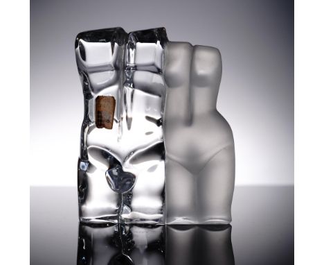 This sculptural Daum crystal figurine features a pair of abstracted nude torsos, one in clear polished crystal representing t