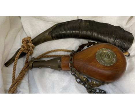 A horn together with a shot flask