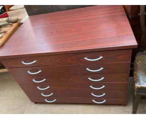 A modern folio chest with six graduated drawers