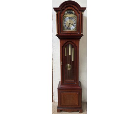 A reproduction mahogany longcase clock, the moon phase dial with Roman numerals, glazed sides and door on a box base and brac