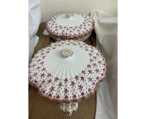 A pair of Spode tureens and covers decorated with flowers and leaves