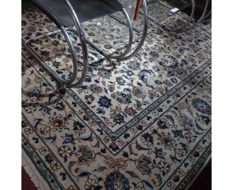 An extremely fine central Persian Nahawand carpet 347 x 245cm repeating stylised petal and spandrels motifs on an ivory field