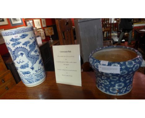 A Chinese blue and white porcelain stick stand decorated with dragons together with a Chinese blue and white jardiniere havin