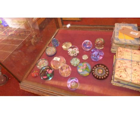 A collection of various paperweights including Perthshire Concentric, Baccarat, and Caithness 