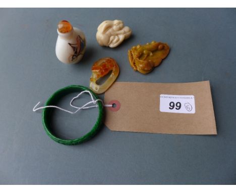A collection of Chinese items including a carved bangle, two agate carvings, another carved item and a glass snuff bottle 