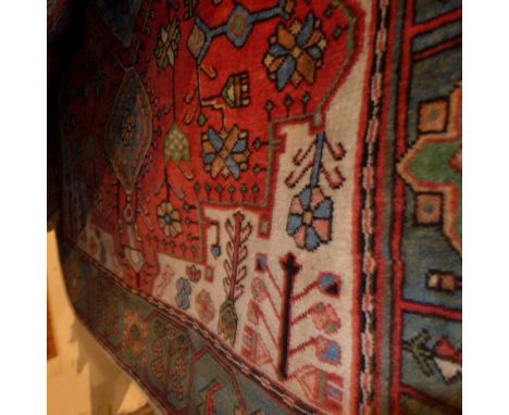 A fine north west Persian Nahawand rug 208 x 138cm central diamond jade medallion on a rouge field within stylised floral jad