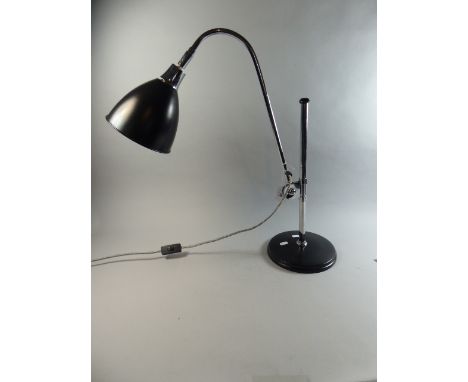 A Modern Rise and Fall Reading Lamp with Chromed Support 