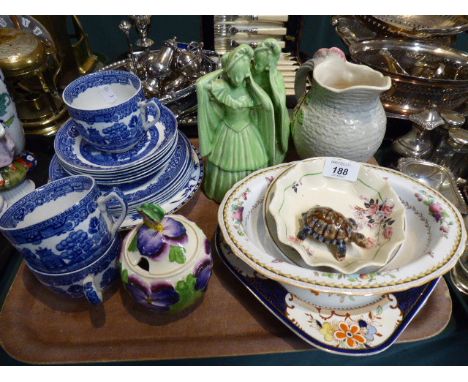 A Tray of Ceramics to Include Figural Ornaments, Decorated Jug, Blue and White Cups and Saucers