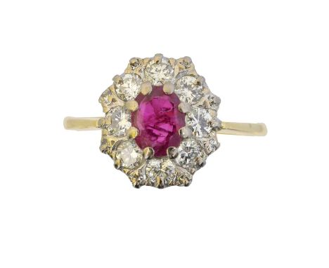 An 18ct gold ruby and diamond cluster ring, An 18ct gold ruby and diamond cluster ring, the oval shape ruby within a brillian